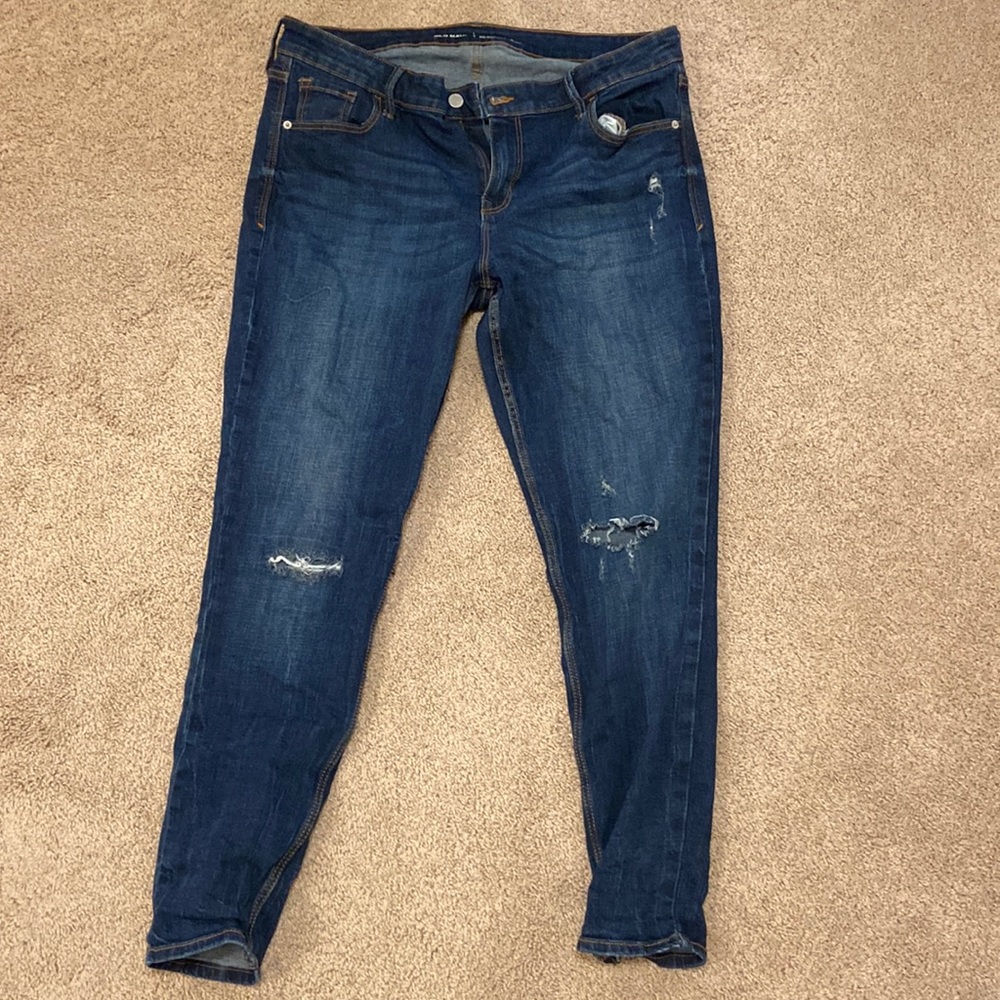 Old navy dark blue jeans with some design rips. Rockstar mid rise style. Size 15